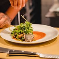 Person with Plate of Food on Table